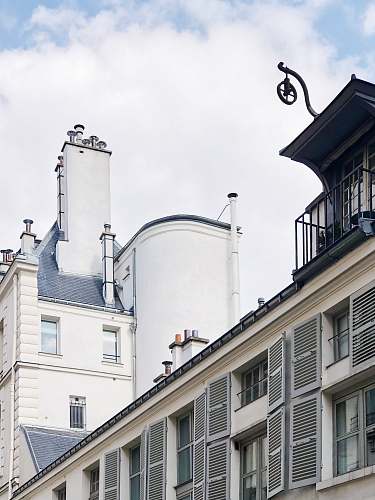 home decor white concrete building under white sky window